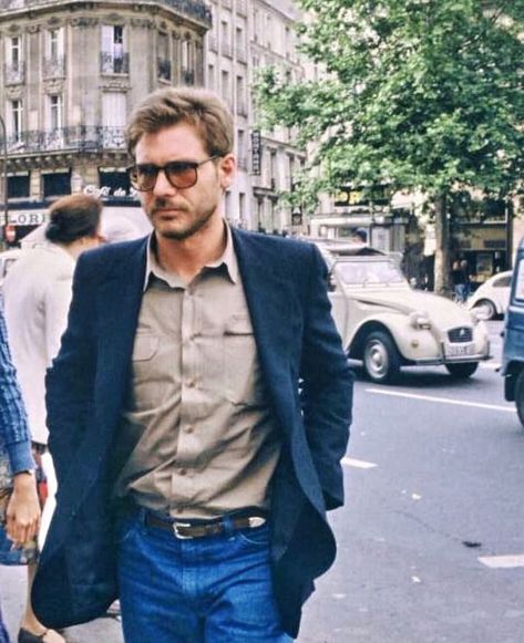 The Traveling Gentleman on Instagram: “A walk through Saint-Germain in Paris with a young Harrison Ford in 1978. Café de Flore @cafedeflore_paris and a Citroen 2CV in the…” Harrison Ford, A Man, Ford, Paris, Cars, On Instagram, Instagram