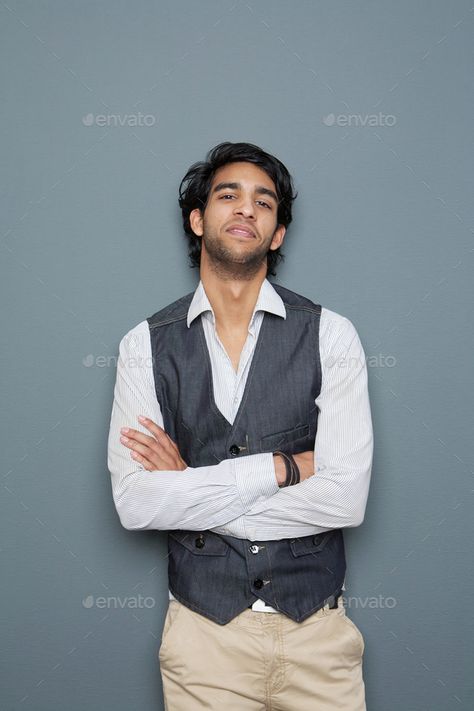 Casual young businessman posing with arms crossed by mimagephotography. Portrait of a casual young businessman posing with arms crossed against gray background #AD #posing, #arms, #businessman, #Casual Person Standing With Arms Crossed, Guy Crossing Arms, Man Crossing Arms, Crossing Arms, English Assignment, Crossed Arms, Reference Pictures, Graphic Design Portfolio, Drawing Poses