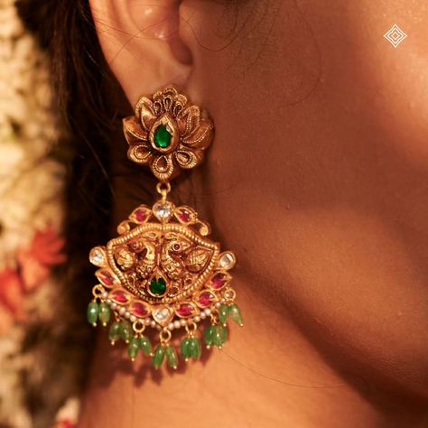 Every detail is a stroke of elegance. Complete your bridal look with our exquisite 22K gold embossed Nakshi jhumkas. These stunning earrings perfectly complement any traditional ensemble, adding a touch of timeless elegance. WhatsApp 9964641869 for enquiries. 📍Visit the Blue CKC&Co. Flagship store , near Safina Plaza. Look for the DIAMOND logo! #CKCCo #JewelleryLovers #InstaJewellery #JewelleryAddict #HandmadeJewellery #IndianJewellery #TraditionalJewellery #IndianBridalJewellery #EthnicJ... Nakshi Jhumkas, Nakshi Earrings, Big Earrings Gold, Indian Bridal Jewellery, Antique Necklaces Design, Antique Necklaces, Diamond Logo, Aesthetic Letters, Jewellery Indian