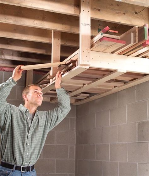 I like working in my basement shop, but the floor space is limited. So when it came time to put up a lumber rack, I screwed it to the ceiling because that’s the only space that was wide open. I designed the rack so it holds both long and short boards and installed it at a height that is convenient to reach but high enough so I … Shed Organisation, Basement Shop, Officine In Garage, Lumber Storage Rack, Lumber Rack, Lumber Storage, Shed Organization, Garage Organize, Diy Garage Storage