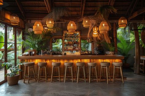 Tropical flavors cocktail bar with bamboo stools, tiki-style thatched roof, and exotic vacation vibes for a unique royalty free stock photo Tiki Bar Flooring, Jungle Bar Design, Tropical Theme Bar, Bamboo Bar Design, Tropical Bar Design, Sisha Bar, Modern Tiki Bar, Bamboo Tiki Bar, Tiki Bar Stools