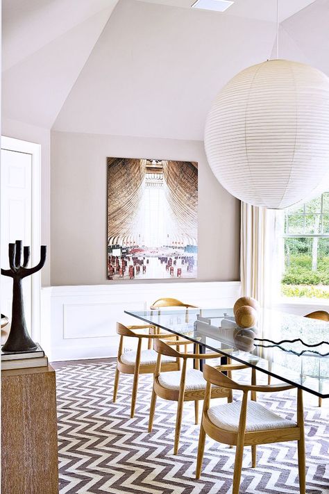 Modern dining room design in neutral tones featuring a tan and white chevron area rug, light wood wishbone chairs, a glass top table, and a large paper lantern chandelier - Dining Room Ideas & Decor Modern Glass Dining Table, Rooms Ideas, Hamptons House, Boho Modern, The Dining Room, Dining Room Inspiration, Design Del Prodotto, Glass Dining Table, Modern Dining Table