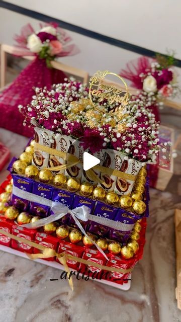 Hampers Decoration Ideas, Gift Hamper Decoration Ideas, Packing Ideas Gift Diy, Chocolate Decorations For Wedding, Birthday Chocolate Bouquet, Chocolate Decorations For Gift, Chocolate Tower Ideas, Food Hampers Ideas, Bridal Gift Hamper Basket Ideas