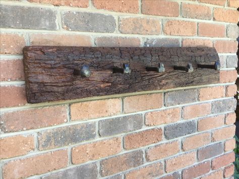 Rustic coat rack crafted with Redgum Sleeper and Railway spikes Rail Spike Coat Rack, Sleeper Wood Ideas, Railway Spike Coat Rack, Diy Wall Mount Plant Holder, Railway Spikes Ideas, Railroad Spikes Crafts, Timber Feature Wall, Wall Hook Rack, Rustic Coat Rack