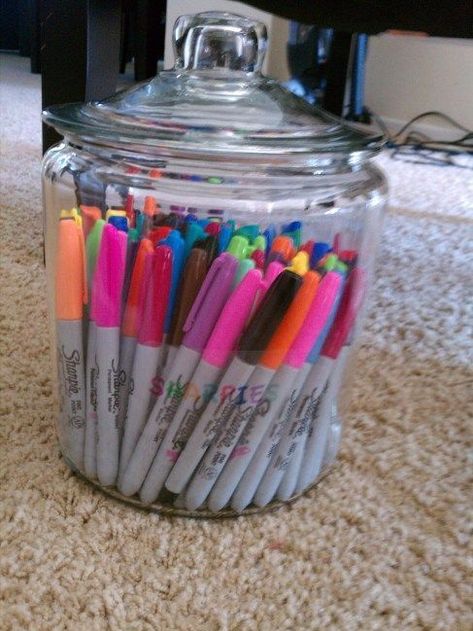 Use a glass jar to store and organize your colored pens in a stylish and functional way. This simple yet creative idea adds a pop of color to your craft room while keeping your supplies easily accessible. Check this article to learn more! Ideas For Organizing, Ribbon Organization, Crayon Holder, Small Mason Jars, Sharpie Pens, Ways To Organize, Pen Storage, Clear Container, Pen Organization