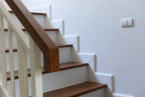 How To Do Baseboard Around Stairs: A Step-By-Step Guide Baseboard For Stairs, Trim Around Stairs Staircases, Baseboard On Stairs, Stair Edge Trim, Staircase Baseboard Trim, Stair Skirt Board Diy, Stair Baseboard Trim, How To Build Stairs Indoors, Stairs Without Skirt Board