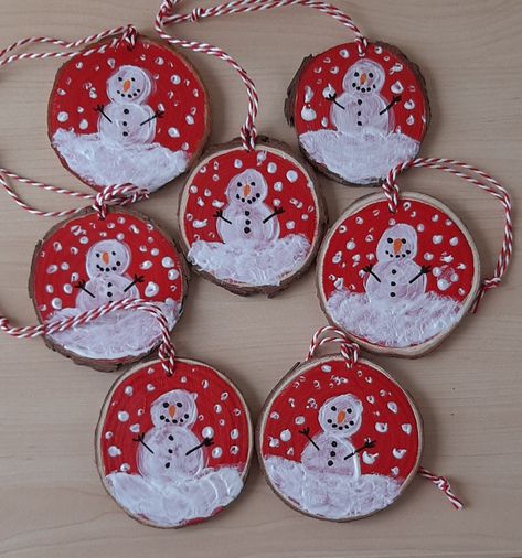 This wooden snowman ornament would be lovely to hang on the Christmas tree or in any room in the home to give it a festive feel, it could also be hung from a door or cupboard handle.  The wooden snowman decoration is painted red with a festive design in acrylics with a red and white string for hanging.  Product description *Acrylic paint on a circular wooden disc.  *Acrylic paint in red and white. *With a red and white string for hanging. *Ready to hand to decorate the Christmas tree or any room Painted Wooden Discs, Christmas Ornaments With Wood Slices, Wooden Disk Ornaments, Wooden Disc Christmas Ornaments, Handmade Christmas Ornaments For Kids, Wooden Tree Ornaments, Wooden Circle Ornaments Diy Kids, Snowman Ornament, Christmas Wooden Ornaments