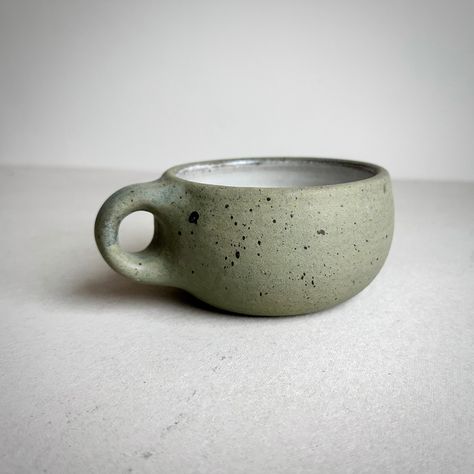 "MADE TO ORDER Round Mug Aged Green 4.5\" wide x 2.5\" tall / Holds approximately 11-12 oz. Your order will be added to my queue and it will take me 4-6 weeks from date of purchase to make before shipping out.  ** Pictures are just photos of the previous mug.  Each one is individually made so there will be slight variations in surface and shape. Please give me time to make enough pots to fill the kiln before firing so it's more energy efficient. Thanks :-)   Cappuccino or latte anyone?  Made to Cappuccino Mugs Ceramics, Ceramic Cappuccino Cups, Cappuccino Mug, Clay Handles, Handmade Pottery Mugs, Cappuccino Mugs, Cerámica Ideas, Rustic Ceramics, Hand Thrown Pottery