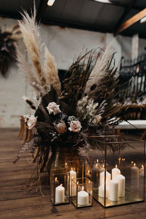 WEDDING INSPIRATION #albany #boholuxe #bohemianwedding #styling #pampas #weddingideas Dark Pampas Grass Decor, Winter Pampas Grass Wedding, Black Christmas Wedding Decor, Moody Pampas Grass Wedding, Black Rustic Wedding Table Decor, Table Vases Wedding, Dark And Moody Wedding Ceremony Decor, Dark Moody Boho Wedding, All Black Boho Wedding