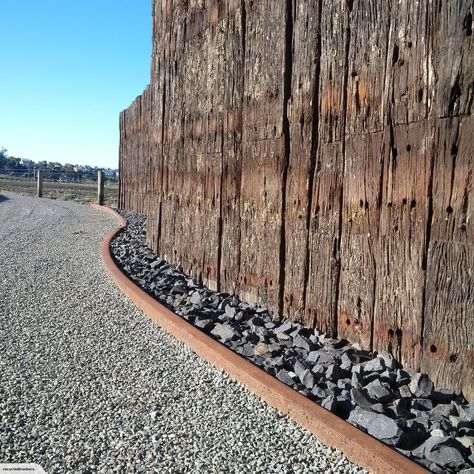 75x Jarrah Hardwood Railway Sleepers $1 reserve | Trade Me Railway Sleepers Garden Ideas, Railway Sleepers Fence Ideas, Railway Sleeper Fence, Railway Sleeper Retaining Wall Ideas, Railway Sleepers Retaining Wall, Railway Sleepers Garden Curved, Reclaimed Railway Sleepers, Sleeper Retaining Wall, Luxury Dog House