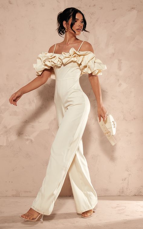 Elevate any look with this cream satin ruffle bardot strappy jumpsuit. Brought to you in a cream satin material with a ruffled design that is sure to add a touch of luxe to your outfit. Its bardot fit and strappy detail adds chic vibe to your occasion outfit. Team this unreal jumpsuit with a pair of heels to finish off the look we are loving. Length approx 155cm/61inch (Based on a sample size UK 8) Model wears size UK 8/ EU 36/ AUS 8/ US 4Model Height - 5ft 9inchp]:!mb-0inch>Category: Jumpsuits & PlaysuitsProduct type: JumpsuitColour: CreamMaterial: SatinOccasion: Occasion Strappy Jumpsuit, Occasion Outfit, Ruffle Jumpsuit, Jumpsuit Online, Satin Material, Playsuit Jumpsuit, Jumpsuits For Women, Jumpsuit, Satin