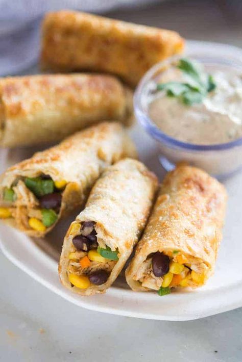 Crispy Southwest Egg Rolls (that you can bake or fry!) served with a creamy cilantro dipping sauce. These could be my favorite party appetizer of all time, (and they're freezer friendly)! Southwest Eggrolls, Southwest Egg Rolls, Favorite Party Appetizers, Chicken Egg Rolls, Chicken Spring Rolls, Tastes Better From Scratch, Egg Roll Recipes, Party Appetizer, Cheesecake Factory