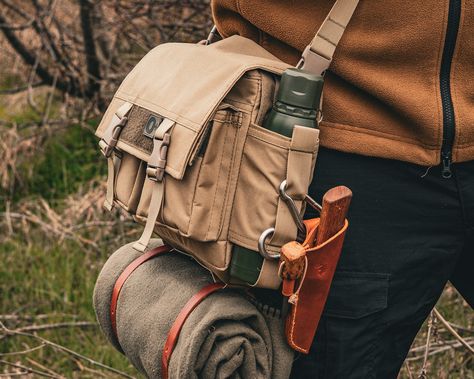 Bushcraft Shoulder Bag crafted from tough and water-resistant 600x300 D PVC canvas, lined with durable Oxford Polyester 600D, and featuring padded sides for extra protection. Bag: - Width - 30cm - High - 25cm - Deep - 10cm Strap Length:  110cm - 160cm Two frontal and two inner pockets, and two side pockets with a water bottle section. The shoulder strap is removable and adjustable. Bushcraft Backpack, Steampunk Bag, Bushcraft Kit, Edc Bag, Bushcraft Gear, Combat Gear, Tactical Bag, Adventure Gear, Hiking Backpack