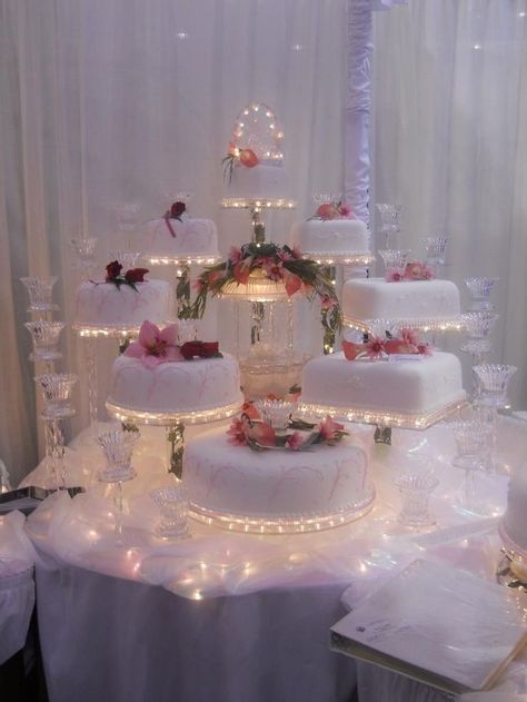 A custom Celestial Cascade display #tallcakes #knockshoppe #cakeswithcandles #lightedweddingcake #cakesofinstagram #lightedweddingcake Cakes With Fountains, Fountain Wedding Cakes, Quince Cakes, Fancy Wedding Cakes, Wedding Cake Display, Wedding Cakes Elegant, Quinceanera Cakes, Torte Cupcake, Floral Wedding Cakes