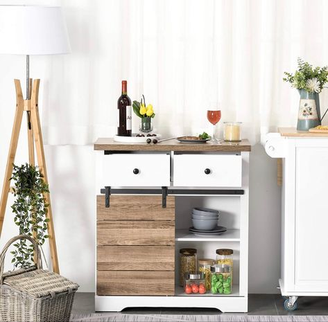 This modern farmhouse-inspired storage cabinet makes a distinct statement in any setting. Barn door style sliding door with retro hardware evokes a rustic charm in your home. Modern Sideboard Buffet, Coffee Bar Cabinet, Storage Sideboard, Farmhouse Buffet, Farmhouse Coffee Bar, Modern Farmhouse Living, Sideboard Storage Cabinet, Rustic Barn Door, White Dining Room