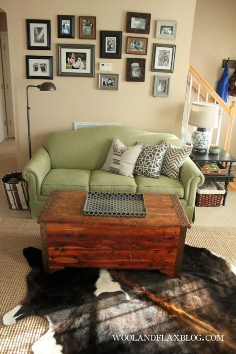 Living Rooms with Cowhide Rugs | eclectic living room; green couch; cowhide rug | Cowhide Rugs Living Room Green Couch, Narrow Room, Green Couch Living Room, Couch Wall, Room Green, Green Couch, Wall Displays, Eclectic Living, Office Lounge