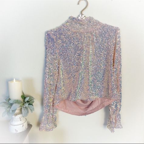 Beautiful And Unique Glittering Allover Sequined Mock-Neck Top With A Dramatically Draped Open Back. Back Button Closure. Mock Neck. Long Sleeves. Mesh Lining. Color: Lilac Glow Condition: New (With Tag) Contents: 95% Polyester 5% Elastane From Pet Free & Smoke Free Home. Open Back Top, Mock Neck Top, Free People Tops, Mock Neck, Open Back, Lilac, Sequin, Free People, Long Sleeves