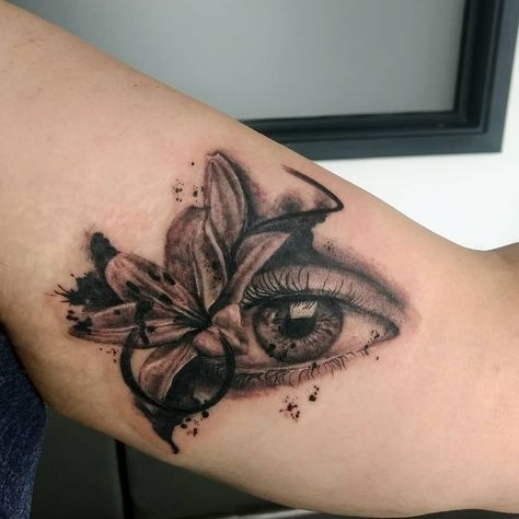 Loved doing this splatty eye and lily design today! I really love doing realism #eye #lily #blackandgreyrealism #blackandgrey #flower… Eye Tattoo With Flowers, Eye In Flower Tattoo, Flower Eye Tattoo Design, Flower Eye Tattoo, Lily Dog Tattoo, Realism Eye, Eyes Tattoo, Lily Design, Lily Tattoo