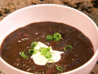 Spicy Black Bean Soup Recipe | The Neelys | Food Network Spicy Black Bean Soup Recipe, Spicy Black Bean Soup, Easy Black Bean Soup, Slow Cooker Black Beans, Black Bean Soup Recipe, Bean Soup Recipe, Bean Soup Recipes, Black Bean Soup, Bean Soup