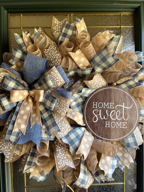 Beautiful Farmhouse rustic country style wreath that can be displayed on a front door, wall, interior door, or over a fireplace mantel. Beige deco mesh, denim blue and ivory checked wired ribbon, solid denim blue wired ribbon, beige with white berries wired ribbon, beige and ivory polka dot wired ribbon, matching ribbon bow, and a Home Sweet Home metal sign are securely attached to a wire frame made to last for years to come. Makes a great gift for a birthday, housewarming, or any occasion. All Big Wreath, Diy Deco Mesh Wreath, Fall Mesh Wreaths, Mesh Ribbon Wreaths, Farmhouse Style Wreath, Home Wreath, Dried Wreath, White Berries, All Season Wreath