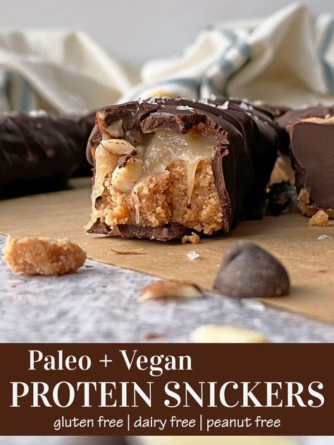 These healthy Snicker Protein bars are packed with protein, Paleo, Vegan, peanut free and gluten free. They have a raw almond-protein nougat topped with dairy free caramel, chopped almonds and dipped in dark chocolate. These are the best homemade Snickers Bars! #snickers #proteinbar #paleo #vegan Paleo Candy Bars, Protein Snickers, Paleo Candy, Chocolate Fudge Bars, Candy Bar Recipe, Vegan Paleo Recipes, Healthy Candy, Homemade Snickers, Paleo Recipes Dessert