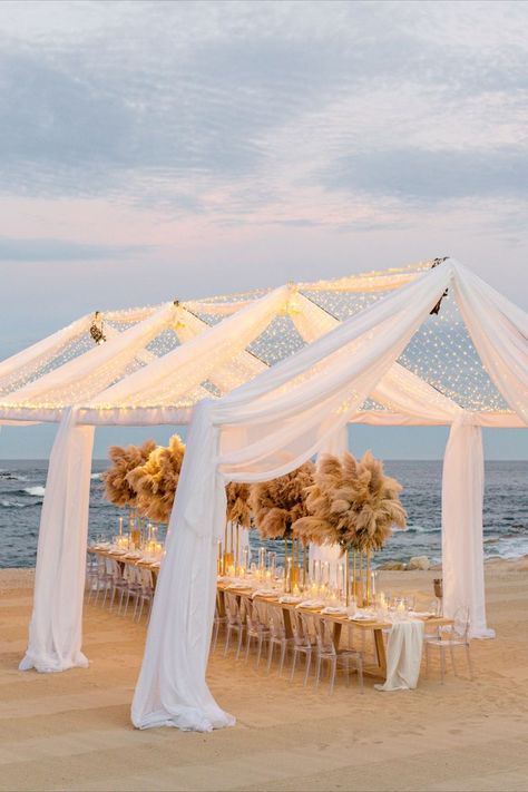 Beach Wedding Reception, Stunning Tent Lights, Beach Wedding Decor, Beach Wedding Inspiration, Tent Lighting Ideas, Beach Wedding Ideas, Outdoor Wedding Reception, Beach Wedding Reception Decor, wedding 2024, wedding reception, september wedding, october wedding, unique wedding ideas, timeless wedding, outdoor wedding, hanging decor, wedding flower inspo, #wedding #weddingflowers #weddingideas #destinationweddingplanner #napaweddingplanner #californiaplanner #weddinginspiratoin Beach Wedding Dinner Ideas, Simple Beach Reception, Micro Wedding Beach, Simple Beach Wedding Ideas Decor, Small Beach Wedding Reception, Micro Wedding Reception Ideas, Beach Wedding Venue Ideas, Beach Wedding Food Ideas, Simple Beach Wedding Reception