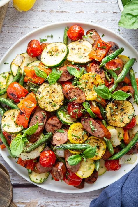 Marinated in a flavorful vinaigrette and grilled to smoky perfection, these grilled summer vegetables and sausage will satisfy both meat-lovers and veggie-lovers! Blackstone Meat And Veggies, Beef Summer Sausage, Roasted Smoked Sausage And Veggies, Grilled Sausage And Veggies, Smoked Sausage Veggie Skillet, Grilled Sausage Recipes, Summer Sausage Recipes, Summer Sausage, Veggie Sausage