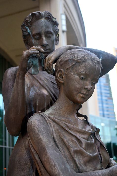 https://flic.kr/p/o74NQ3 | Mother & Daughter | The Mother-Daughter statue was in remembrance of the charity and volunteer work by Patricia Austin, the wife of former mayor Ed Austin. It was unveiled Mother's Day weekend in May 2003 by her nine grandchildren. It is a symbol of all the children and families she touched throughout her life. It is a symbol of her love and devotion to her children. Artist Bruce Wolfe from California sculpted the bronze statue in the figure of a mother tying a rib... Mother Symbolism, Mother Figure Aesthetic, Mall Exterior, Glass Menagerie, Mothers Day Weekend, King Lear, How To Tie Ribbon, In Remembrance, Volunteer Work