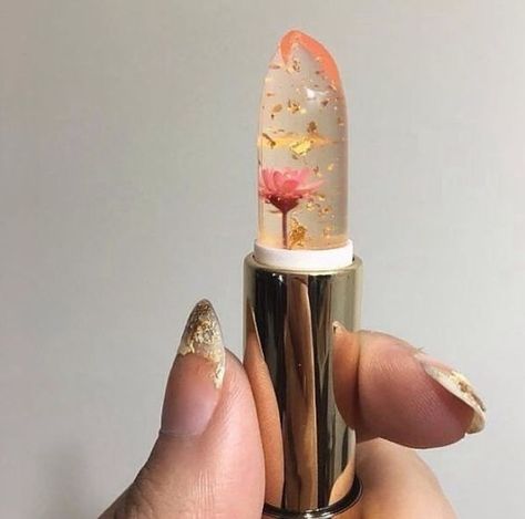 Clear lipstick with gold flakes and a flower inside Clear Lipstick, Flower Lipstick, Jelly Flower, Jelly Lipstick, Ios Wallpapers, Retro Designs, Music Fashion, Diy Style, Beautiful Makeup