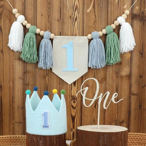 PRICES MAY VARY. 💓【PACKAGE CONTENTS】💓A tasseled garland banner containing the number "1" in white, green and blue with wooden beads. A blue crown hat with the number "1" and a "one" cake topper. This set is a great way to add a touch of color to your baby's birthday party. 💞【EASY TO ASSEMBLE】💞These products require no assembly and are easy to use. The banners are easy to hang and take no time to decorate. We will maximize your convenience. 💖【EXCELLENT QUALITY】💖The crown hat is well made an Wedding Photo Booth Props, One Cake Topper, 5th Birthday Party Ideas, 1st Birthday Party Decorations, Highchair Banner, Baby Boy First Birthday, One Cake, Blue Crown, Crown Hat