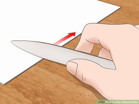 3 Ways to Use a Bone Folder - wikiHow Book Folding Art, Mixed Media Art Techniques, Paper Folder, Book Binder, Art Tool, Envelope Art, Bone Folder, Making Greeting Cards, Stationery Store