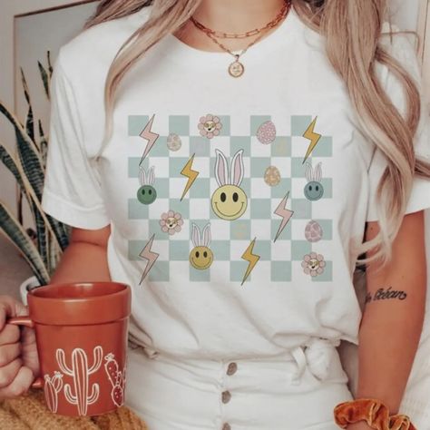 CLOSED - 💗🐰Easter Things Checkered and Retro Graphic Tee🐰💗 💲2️⃣8️⃣ plus tax and shipping. There is no shipping for local pickup. Local pickup will be at the Wal-Mart Marketplace on Shug in Auburn. sizes available: XS, S, M, L, XL, 2XL, 3XL colors available: white, light pink, light blue, natural, silver, ash -ultra soft, longer length, unisex tee -Made in 🇺🇸 -unisex size -We recommend ordering your regular sizes for relaxed for, or sizing down for a more fitted fit. To order: Comment ... Easter Things, Silver Ash, Retro Graphic Tees, Pink Light, Auburn, Shirt Color, The Kids, Women's Accessories, The Shirt