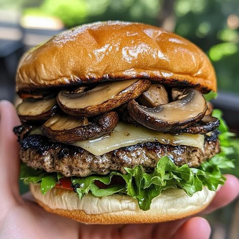 Swiss Mushroom Burger 🍔🧀🍄 Ingredients: For the Burgers: 1 pound ground beef (80/20 blend for juiciness) 🍔 Salt and pepper to taste 🧂 1 teaspoon garlic powder 🧄 1 teaspoon Worcestershire sauce 🌿 4 slices Swiss cheese 🧀 4 hamburger buns 🍞 Lettuce, tomato, and condiments of choice (optional) 🍅🥬 For the Mushroom Topping: 1 cup mushrooms, sliced (button or cremini) 🍄 1 small onion, thinly sliced 🧅 2 tablespoons butter 🧈 1 tablespoon olive oil 🛢️ 1 teaspoon Worcestershire sauce 🌿 Salt and pepper t... Oven Baked Burgers, Burger Ingredients, Baked Burgers, Mushroom Burger, Hamburger Buns, The Mushroom, Swiss Cheese, Worcestershire Sauce, 1 Pound