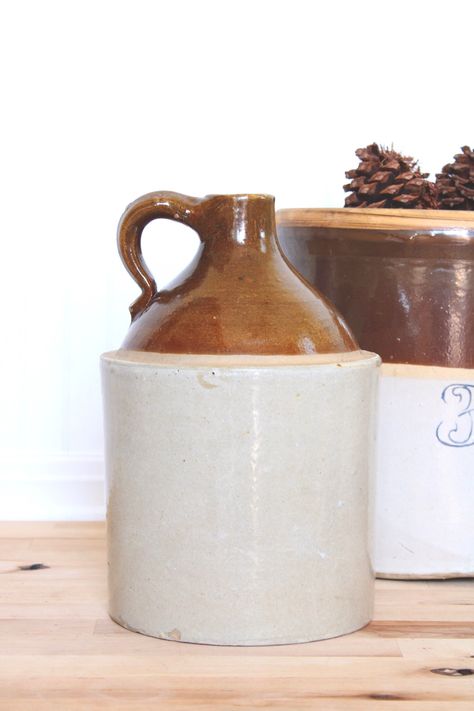 "This antique stoneware jug circa 1900 makes a beautiful statement in any living area, the jug features a brown albany slip and salt glazed base. Perfect for season floral or olive branch arrangements to add a pop into any room. Dimensions: 11\" H x 7.25\" W Condition: Natural wear that adds to the charm, no cracks or chips" Branch Arrangements, Flower Vessel, Country Chic Decor, Farmhouse Vase, Vintage Crock, Antique Stoneware, Vase Flower, Farmhouse Country, Brown Vintage