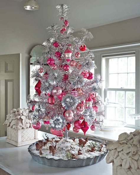 Aluminum Tree Creative Christmas Tree Decorating Ideas | Martha Stewart Living — Forget the electric lights, make your room shine with an aluminum tree filled with removable branches and a central trunk. Christmas Tree Colors, Martha Stewart Christmas, White Christmas Tree Decorations, Amazing Christmas Trees, Faux Christmas Trees, Aluminum Christmas Tree, Tinsel Tree, Creative Christmas Trees, Pink Ornament