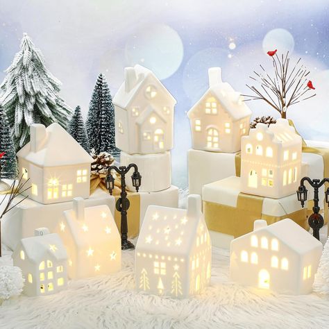 include 8 ceramic houses, 16 trees of different sizes and styles (2 bare branch trees with cardinal, 2 white round pine trees, 2 white long pine trees and 10 green pine trees) and 2 lamp posts, providing an extensive range for your festive decorations
Delightful Christmas Atmosphere: create a charming festive atmosphere with these beautifully designed Christmas village sets; Crafted with reliable ceramic houses, they radiate a warm white light that adds a cozy and welcoming ambience to your home Ceramic Christmas Village, Christmas Village Collections, Christmas Village Sets, Christmas Village Accessories, Lamp Posts, Christmas Tabletop Decor, Christmas Village Houses, Farmhouse Christmas Tree, Christmas Tabletop