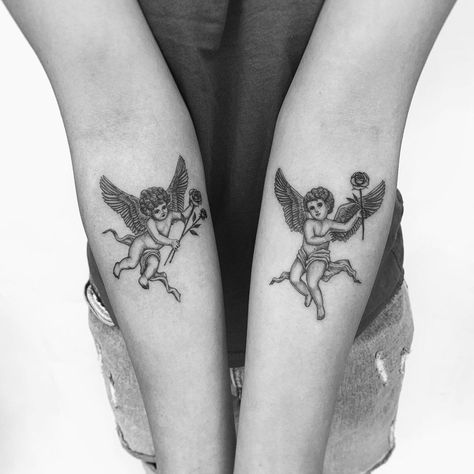 Tattoos of cherubs/angels holding roses. Black and grey, detailed, fineline, microrealism tattoo. Holding Flowers Tattoo, Cherub Tattoos, Holding Hands Tattoo, 2 Cherubs, Body Tattoo Design, Hands Tattoo, Cherub Tattoo, Cross Tattoos For Women, Florida Artist