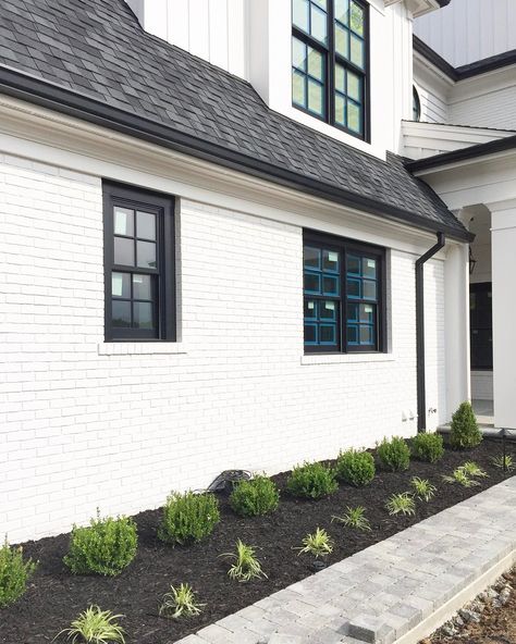 See those fresh plantings? That is a sign that #CampbellQuarters is getting close to completion! (and do you spy that round window?! #swoon ) White Painted Brick Exterior, Clean Interior Design, Roof Shingle Colors, Painted Brick Exteriors, White Exterior Houses, Exterior House Remodel, Round Window, Home Exterior Makeover, Exterior Paint Color