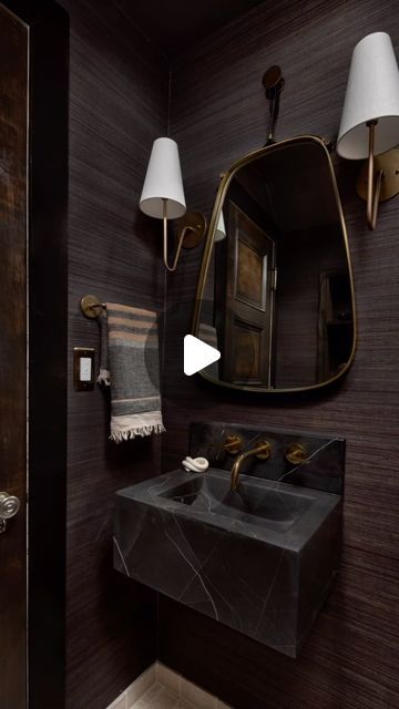 Mary Best on Instagram: "TINY POWDER ROOM reveal! Dark and moody gives sophistication to this 4’ x 6’ space. Nero black marble floating sink + un lacquered brass fixtures is perfectly timeless and dramatic. The grasscloth wallpaper introduces a rich tactile dimension adding depth. Natural yet refined at its BEST!" Small Powder Room Remodel, Powder Room Floating Vanity, Elegant Powder Room Ideas, Moody Powder Room, Elegant Powder Room, Tiny Powder Room, Powder Room Remodel, Floating Sink, Powder Bathroom