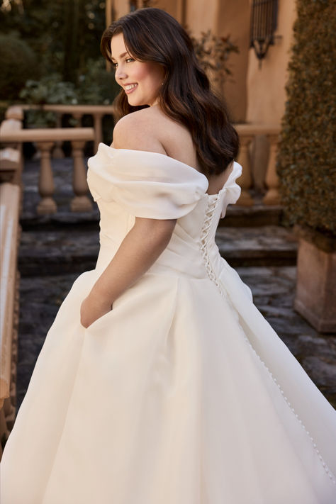 Bring your dream fairytale wedding to life with our timeless Ariane gown. Ariane's ballgown silhouette will have you feeling like royalty on your special day. An off-shoulder beauty with a sweetheart neckline featuring visible boning and organza that drapes perfectly across the bodice, making you feel like the bride of your dreams. Take off the detachable off-shoulder straps for a timeless strapless look. Thought Ariane couldn't get any more perfect? She also has pockets! Off The Shoulder Ballgown Wedding Dress, Masquerade Dress, Puffy Wedding Dresses, Off Shoulder Ball Gown, Blue Ball Gown, Curvy Wedding, Bridal Gown Styles, Sophia Tolli, Disney Weddings