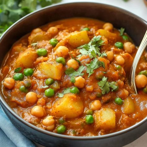 One-Pot Potato Curry - Insanely Good Potatoe Curry Indian Style, Potato Curry Indian, Curry Potatoes, Potato And Pea Curry, Potato Curry Recipe, Green Chili Peppers, Potato Curry, Canned Coconut Milk, Frozen Peas