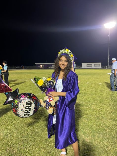 White dress. Purple gown. Flower crown grad cap. Graduation Flower Crown Graduation Cap, Graduation Cap With Crown, Graduation Flower Crown, Crown Grad Cap, Flower Crown Graduation, Crown Graduation Cap, Graduation Cap Flowers, Floral Graduation Cap, Flower Graduation Cap