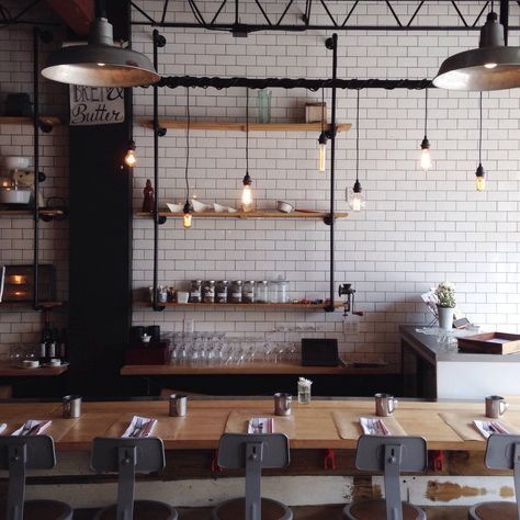 bread & butter | coral gables, florida Café Design, Industrial Cafe, Industrial Kitchen Design, Industrial Restaurant, Cafe Lights, Subway Tiles, Brick Walls, White Brick, Industrial Kitchen