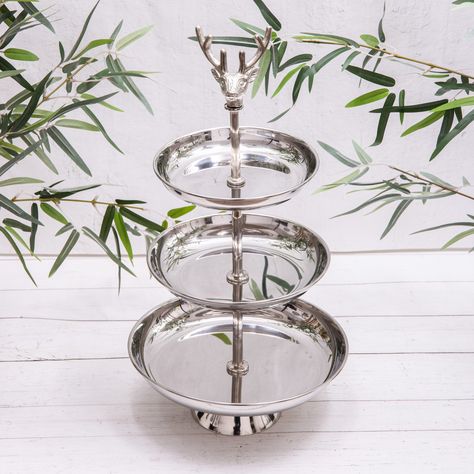 Elegance served in tiers 🦌✨ Elevate your tea time with this stunning silver stag 3-tier cake stand – the perfect blend of rustic charm and refined sophistication. . . . . . . . . . #gift #gifts #gifting #giftshop #giftideas #giftforher #giftgiving #giftsforher #Christmas #christmas #christmastime #christmasgifts #christmasdecor #christmasgiftideas #christmasdecorations #christmasiscoming #afternoontea #afternoon #afternoontea #stag #reindeer #reindeer #housewarming #cakestand #cakestagram #... Reindeer Cakes, Cactus Candles, Metal Cake Stand, Kitchen Accessories Storage, 3 Tier Cake Stand, Outdoor Clock, Kitchen Tray, Free Standing Wall, Outdoor Mirror