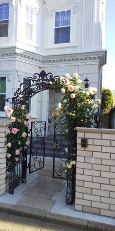 Ready to upgrade your outdoor space? 🏡 Explore our easy landscaping ideas and turn your backyard into a paradise! Click to get started. #OutdoorOasis #HomeImprovement Garden Gate Design, Iron Garden Gates, Front Yard Decor, Sustainable Flowers, Entrance Gates Design, Easy Landscaping, Front Gates, Front Rooms, Deco Retro