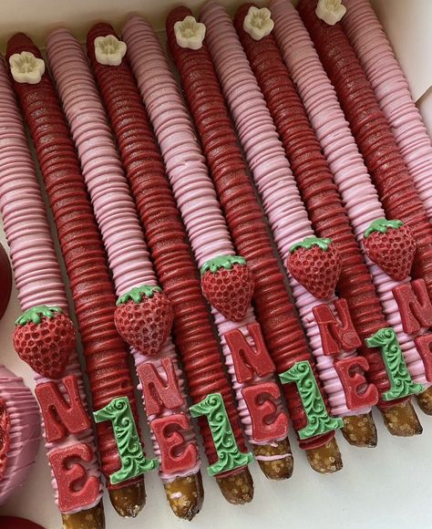 Strawberry Themed Pretzel Rods, Berry 1st Birthday Cake Pops, Strawberry Shortcake Pretzels, Strawberry Shortcake Treats Table, Strawberry Party Treats, Strawberry Theme Treats, Berry First Birthday Treats, Strawberry Shortcake Birthday Ideas, Strawberry Shortcake Treats