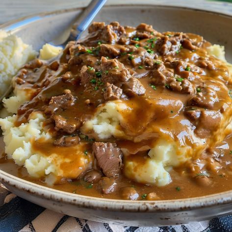 Make Beef and Gravy with Mashed Potatoes Meat Gravy Over Mashed Potatoes, Beef And Gravy With Mashed Potatoes, Mashed Potatoes With Meat, Ground Beef Gravy Over Mashed Potatoes, Mashed Potato Bowls With Ground Beef, Meat And Mashed Potatoes Recipes, Ground Beef Over Mashed Potatoes, Ground Beef And Gravy Over Mash Potatoes, Hamburger Gravy Over Mashed Potatoes