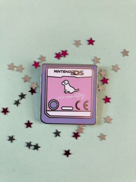 Adorable enamel pin badge featuring the Nintendogs game cartridge. Perfect for any Nintendo fan! #nintendogs #nintendo #gamer . #Fimo #Enamel_Pin_Collection #Backpack_Pins #Jacket_Pins Enamel Pin Collection, Backpack Pins, Jacket Pins, Bag Pins, Game Cartridge, Pretty Pins, Enamel Pin Badge, Enamel Lapel Pin, Cool Pins