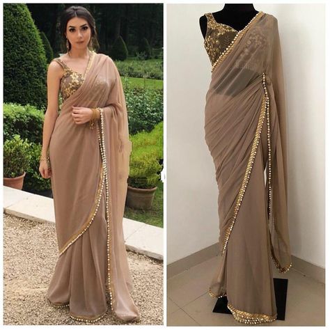 Buy now at 1350/- only. Shop this beautiful outfit for upcoming festivals. FABRICS DETAILS SAREE FABRIC: GEORGETTE SAREE WORK : MOTI LACE BORDER SAREE SIZE: 5.5 MTR BLOUSE FABRICS : BANGLORI SILK BLOUSE WORK : CHAIN STITCH WORK BLOUSE SIZE : 1 MTR #weddingdress #vocalforlocal#dressup #dressoftheday #dressing #dressmaker #dresscode #dresslover #ankaradress #dresses #fashion #dress #style #onlineshopping #fashionista #fashionblogger #instafashion #shopping #women #unlock3.0#lockdown #womensfashion Saree With Lace Border, Traditional Dresses Indian, Indian Bridesmaid Dresses, Saree Traditional, Mirror Embroidery, Latest Indian Saree, Plain Saree, Heavy Embroidery, Bridal Lehenga Choli