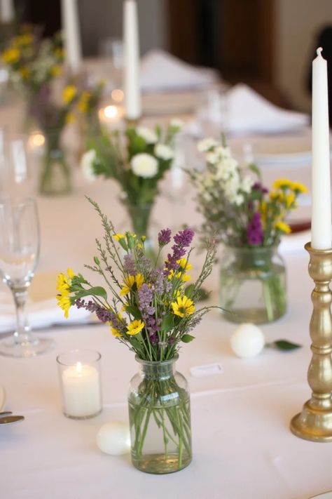 Get ready to brighten up your wedding with these 20 stunning candle wedding centerpieces ideas! Incorporating beautiful bud vases, lush florals, and warm candlelight can create an intimate atmosphere, making your big day truly magical. Whether you're aiming for a traditional look or a boho chic vibe, these creative centerpiece inspirations are sure to mesmerize your guests. From elegant candelabras to simple lanterns, let these ideas ignite your imagination for your perfect celebration. Say I do with enchanting centerpieces that reflect your personal style! Dried Lavender Centerpiece Wedding, Spring Centerpiece Ideas Wedding, Simple Wedding Table Decor Budget, Bud Vases Wedding Centerpiece, Minimalist Wedding Centerpieces, Lavender Centerpieces, Bud Vases Wedding, Colored Taper Candles, Wedding Centerpieces Ideas